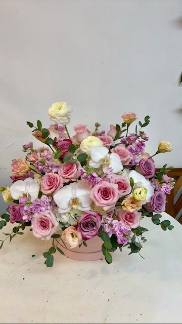 Arrangement with pink, white and green flowers