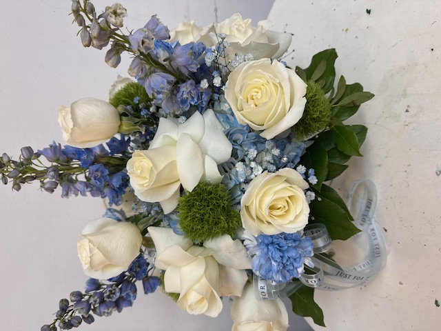 White roses with blue flowers
