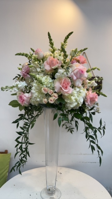 Tall vase with white and pink roses