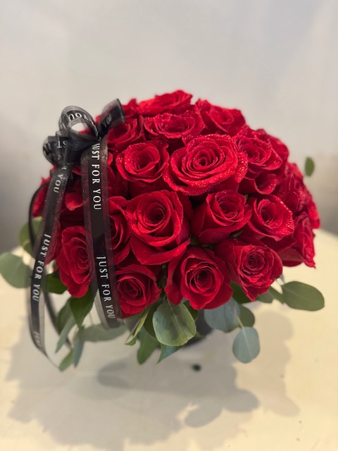 A flower arrangement of red roses