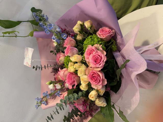 Purple bouquet with pink and white roses