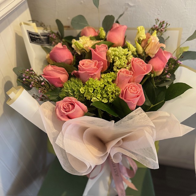 White bouquet with pink roses and green flowers