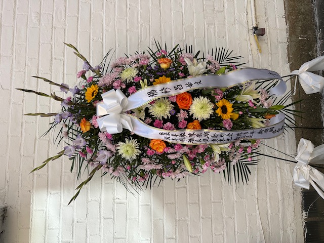 Purple, orange, and yellow roses